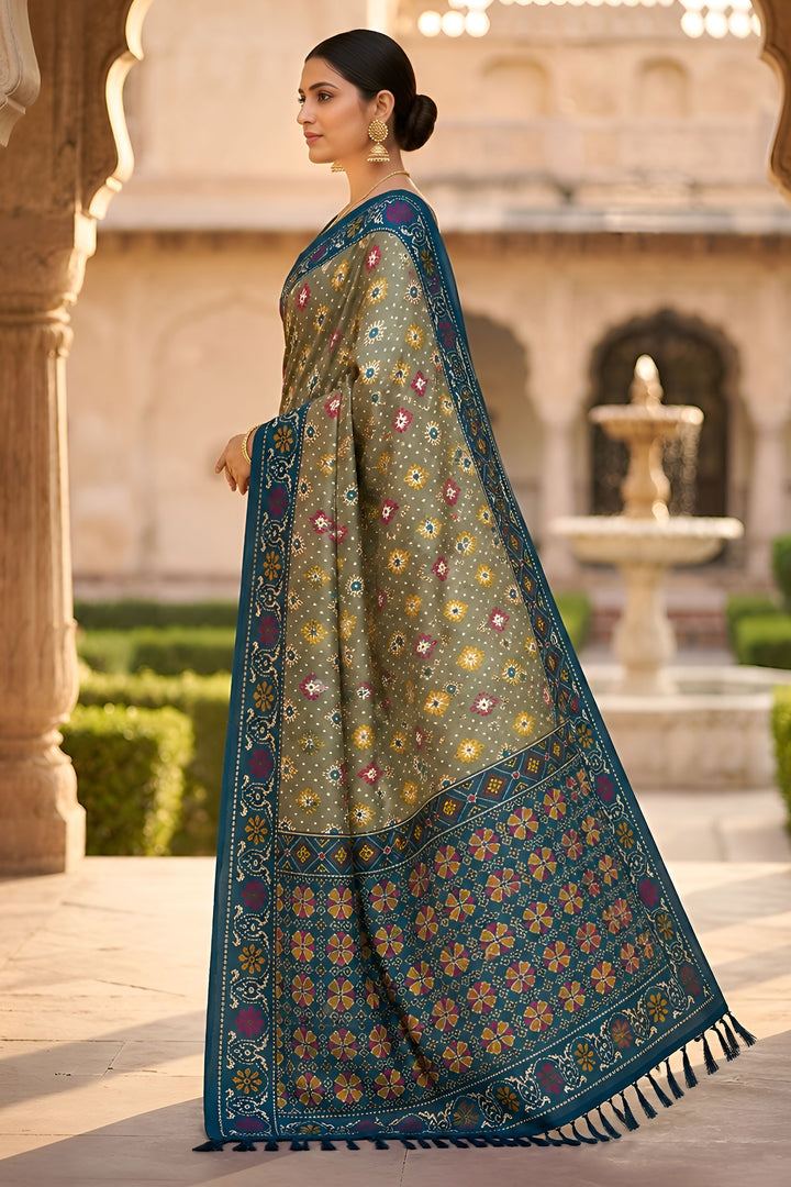 Festive Style Soothing Patola Printed Silk Saree In Green Color